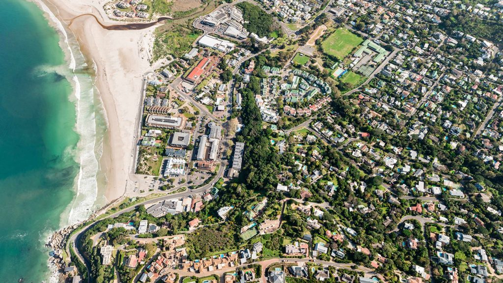 Birds eye view photo of a town by the beach